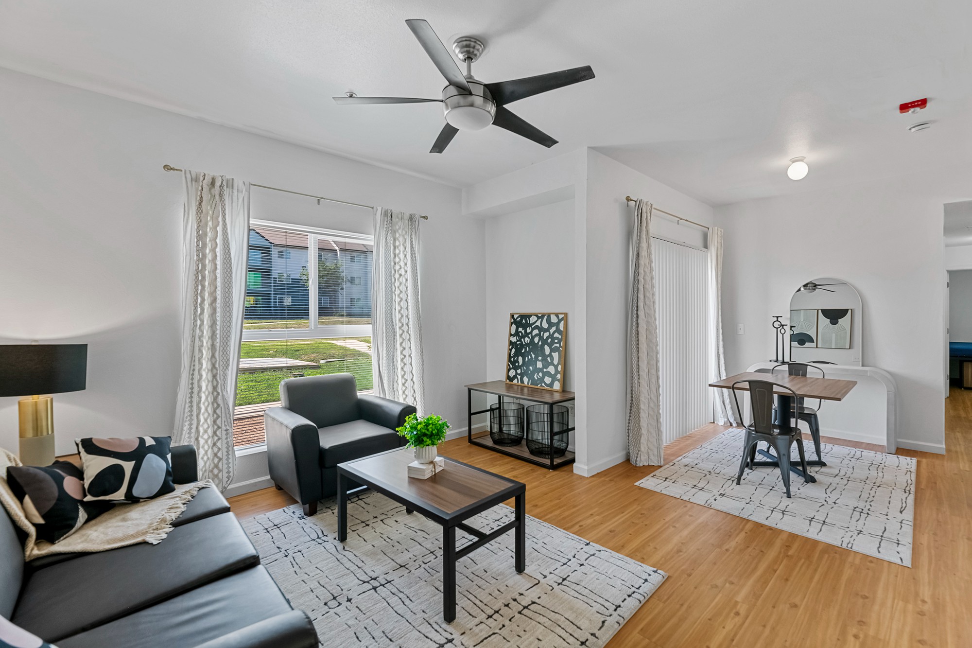 Green Spring Apartments near TXST furnished living room and dining space