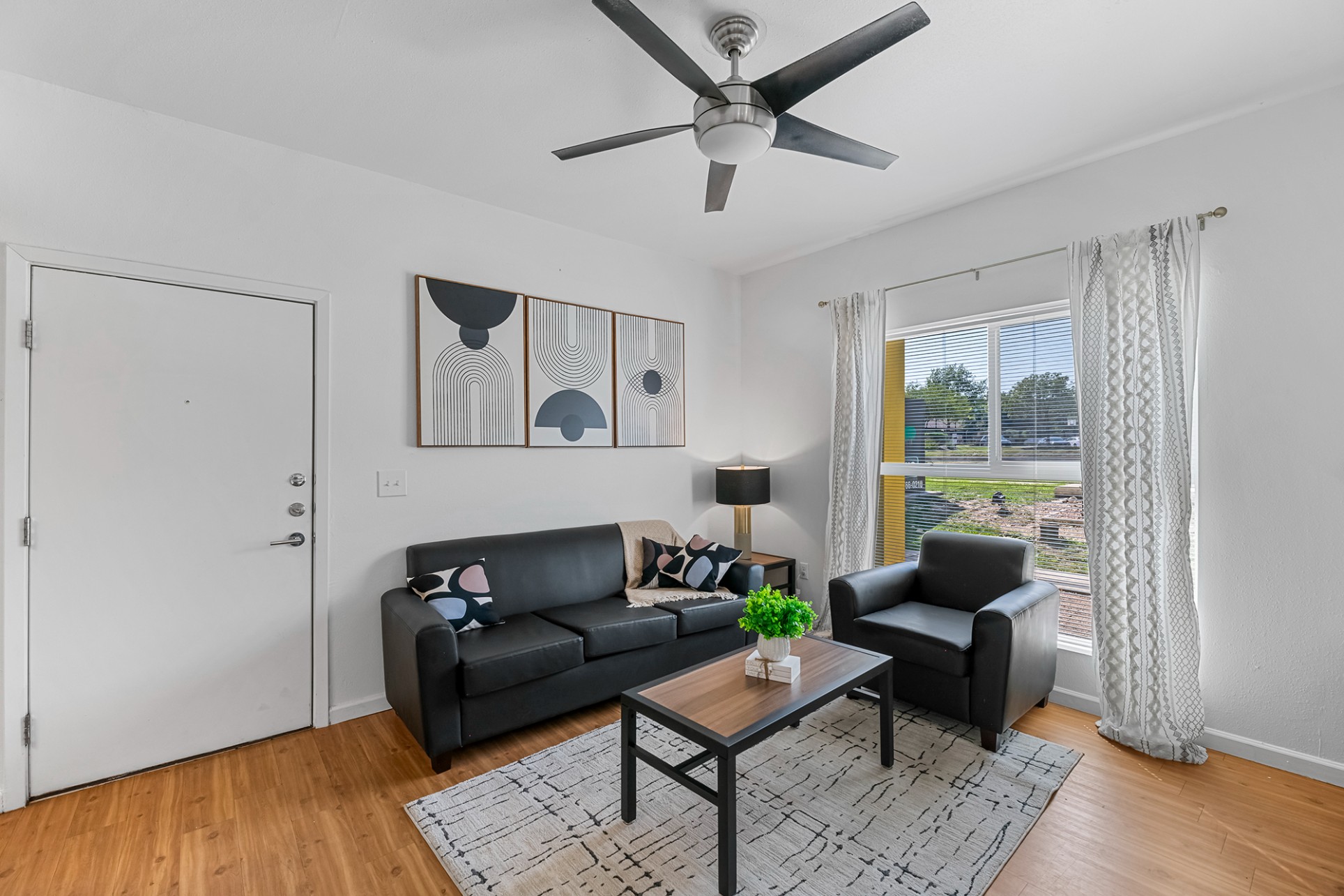 Green Spring Apartments near TXST furnished living room with large windows